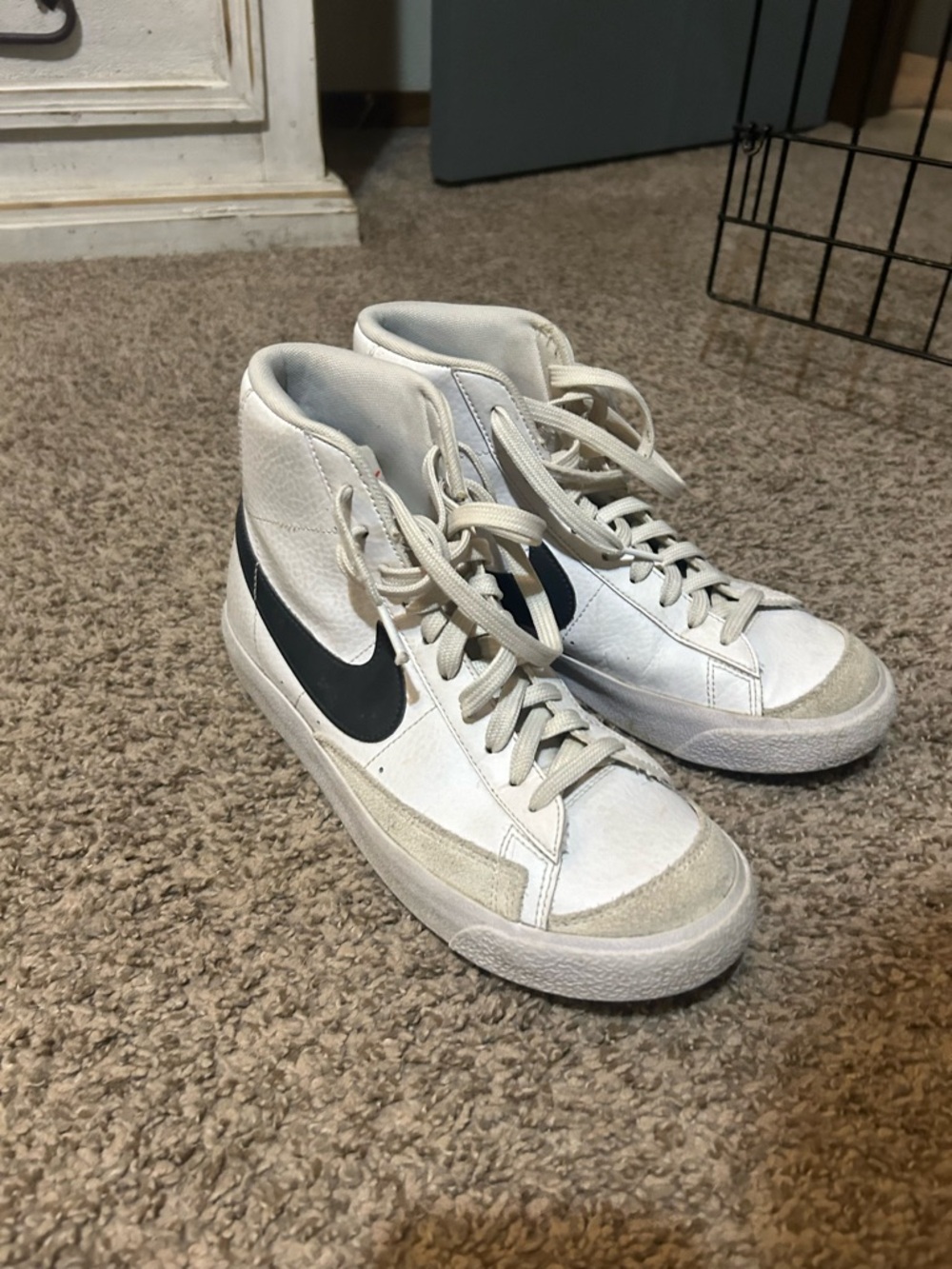 Nike White High-Top Sneakers with Black Swoosh